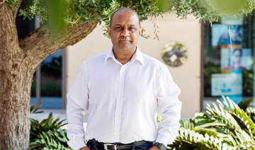 Sanjay Shah poses for a photograph on the Palm Jumeriah Island in Dubai, United Arab Emirates, Sept. 29, 2020. (AP)