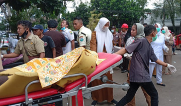 Hunt for buried survivors after Indonesia quake kills 162