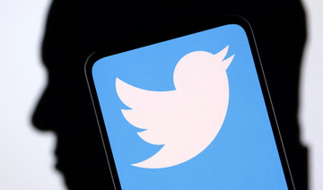 Twitter logo and Elon Musk silhouette are seen in this illustration taken, December 19, 2022. (REUTERS)