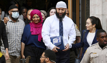 Adnan Syed, center right, leaves the courthouse after a hearing on Sept. 19, 2022, in Baltimore. (AP)