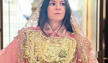 Nasiba Hafiz, board member of AlOula, dressed in a traditional Hijazi costume.