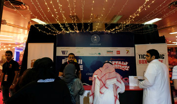 Staff sell tickets at the first Saudi cinema in Jeddah. (REUTERS)