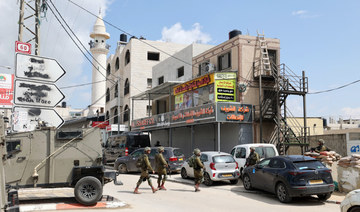 Israeli security forces patrol in the West Bank town of Huwara, on March 26, 2023. (AFP)