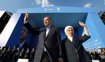 Turkish President Tayyip Erdogan and wife Emine Erdogan greet supporters during a rally ahead of the May 14 elections, in Izmir.