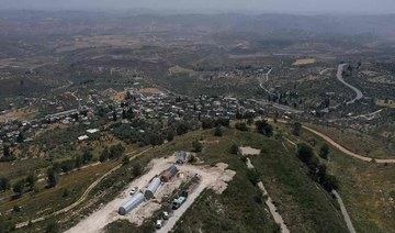 Jewish settlers erect religious school in evacuated West Bank outpost after Israel repeals ban