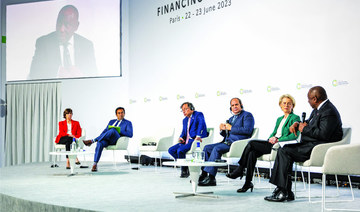 Paris conference urges global financial system overhaul to combat poverty and climate change 