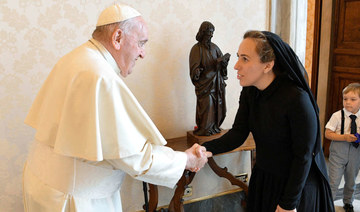 Pope Francis shakes hands with Stella Assange, wife of WikiLeaks founder Julian Assange, at the Vatican, June 30, 2023. (REUTERS