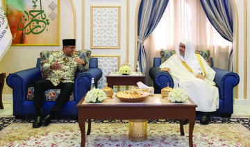 Dr. Mohammed bin Abdulkarim Al-Issa holds talks with Dr. Anies Baswedan in Makkah. (Supplied)