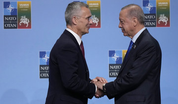 NATO Secretary General Jens Stoltenberg greets Turkish President Recep Tayyip Erdogan at a NATO summit in Vilnius, Lithuania.