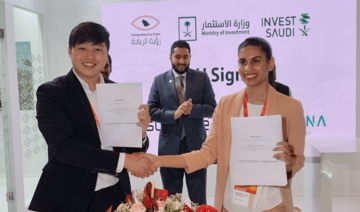 Prince Fahad bin Mansour (C) attends a signing ceremony between Singaporean firm Codesurance and Saudi company Healthgena.