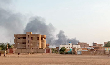 Smoke billows in the distance around the Khartoum Bahri district amid ongoing fighting on July 14, 2023. (AFP)