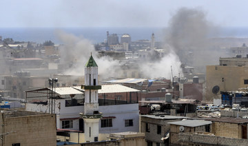 Smoke rises during clashes that erupted between members of the Palestinian Fateh group and militants in Ein El-Hilweh camp.