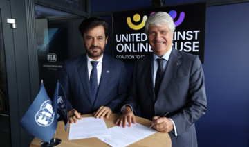 FIA President Mohammed Ben Sulayem and FIM President Jorge Viegas sign a charter to counter online abuse in sport. (Supplied)