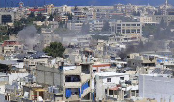 Smoke rises during third day of clashes that erupted between members of Fatah group and Islamist factions in Ein El-Hilweh.