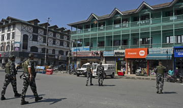 Indian paramilitary troopers patrol along a street in Srinagar. (File/AFP)