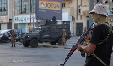 Members of security personnel affiliated with the Ministry of Interior secure the streets after Tuesday’s clashes in Tripoli. 