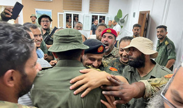 Members of the 444th Brigade receive commander Mahmoud Hamza.