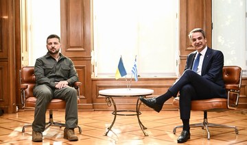 Greece's Prime Minister Kyriakos Mitsotakis (R) meets with Ukraine's President Volodymyr Zelensky at Maximou mansion in Athens.