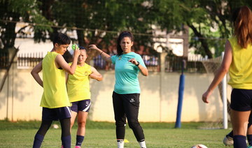 Head coach of the Malaysian women’s national team, Soleen Al-Zoubi, interacts with her players during a training session.