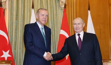 Russian President Vladimir Putin shakes hand with Turkish President Recep Tayyip Erdogan during their meeting in Sochi. (AFP)