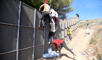 Migrants on Italian island clash with police in housing protest