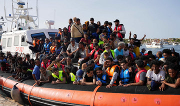 Migrants arrive in the harbour of Italian island of Lampedusa, on September 18, 2023. (AFP)