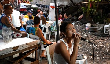 ‘We love singing’: Filipinos find joy in karaoke