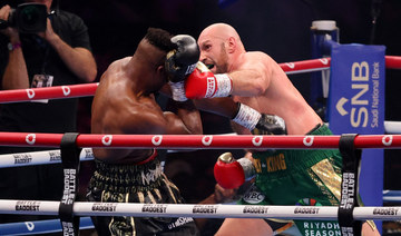 Tyson Fury survives scare from former UFC fighter Ngannou to win split decision in ‘Battle of the Baddest’