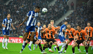 Paris Saint-Germain advances in tense finish to Champions League group. Porto also into round of 16