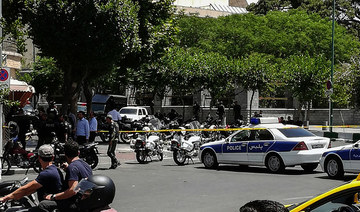 Gunmen kill 11 people, injure several others in an attack on a police station in Iran, state TV says