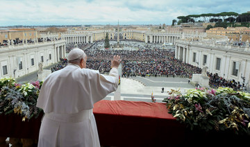 Pope Francis gestures as he delivers his traditional Christmas Day Urbi et Orbi message.