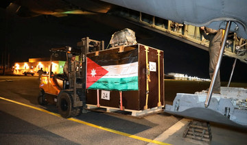 Members of the Jordanian military load humanitarian aid into a plane to be airdropped to a church in Gaza on Christmas Eve.