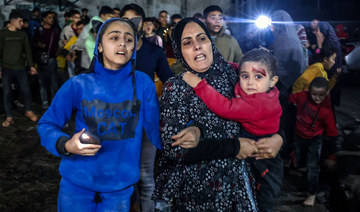 Victims of an Israeli army strike arrive at Kuwait hospital in Rafah in the southern Gaza Strip on Dec. 28, 2023. (AFP)