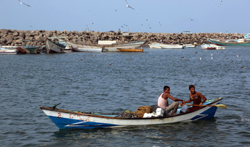 Yemeni fishermen row their boat in the Red Sea city of Hodeidah. (File/AFP)