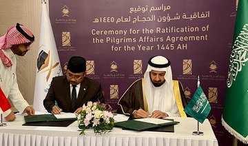 Indonesia’s Religious Affairs Minister Yaqut Cholil Qoumas and Saudi Hajj, Umrah Minister Tawfiq Al-Rabiah sign Hajj agreement.