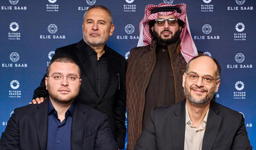 Faisal Bafarat, right, and Elie Saab Jr. sign an MoU in London with Turki Al-Sheikh and Elie Saab present. (Supplied)