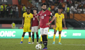 Egypt’s Mohamed Salah waits to take a penalty, which he scores for his side, during African Cup of Nations Group B soccer match.