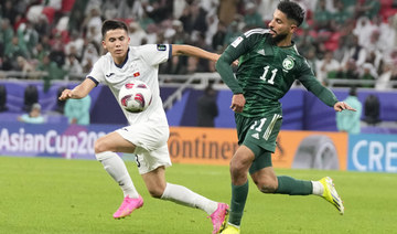 Saudi Arabia beat 9-man Kyrgyzstan to book knockout spot