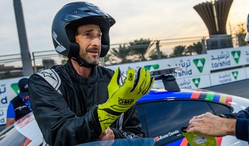 Adrien Brody heats up the desert in Formula E race