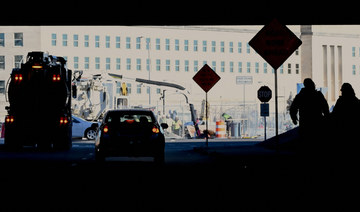 People walk towards the Pentagon in Washington, DC, on January 11, 2024. (AFP)