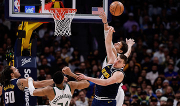 Nuggets down Bucks to spoil Rivers opener; Wolves roll back Thunder