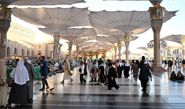 People walk in the courtyard of the Prophet’s Mosque in Madinah. (File/SPA)