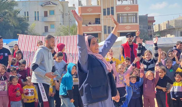 Palestinian Scout Association members volunteer to assist displaced people in war-torn Gaza