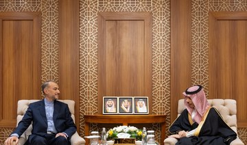 Saudi Arabia’s Foreign Minister Prince Faisal bin Farhan shakes hands with Iranian Foreign Minister Hossein Amir-Abdollahian.