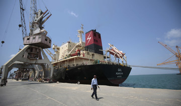 A worker walks past of a cargo ship at the port of Hodeidah, Yemen. (AP file photo)