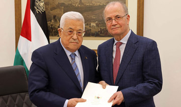 Palestinian President Mahmoud Abbas with the newly appointed Premier Mohammed Mustafa in Ramallah, West Bank. (AFP)