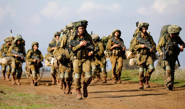 Israeli soldiers take part in a military exercise near the Kibbutz of Merom Golan in the Israeli-annexed Golan Heights. (AFP)