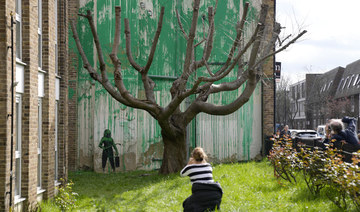 Banksy mural to be protected after London paint attack