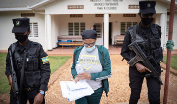Beatrice Munyenyezi is escorted by police officers at a court in Kigali, Rwanda. (AFP file photo)