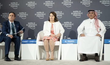 Abdulrahman Al-Fageeh (R), CEO of the Saudi Basic Industries Corporation.